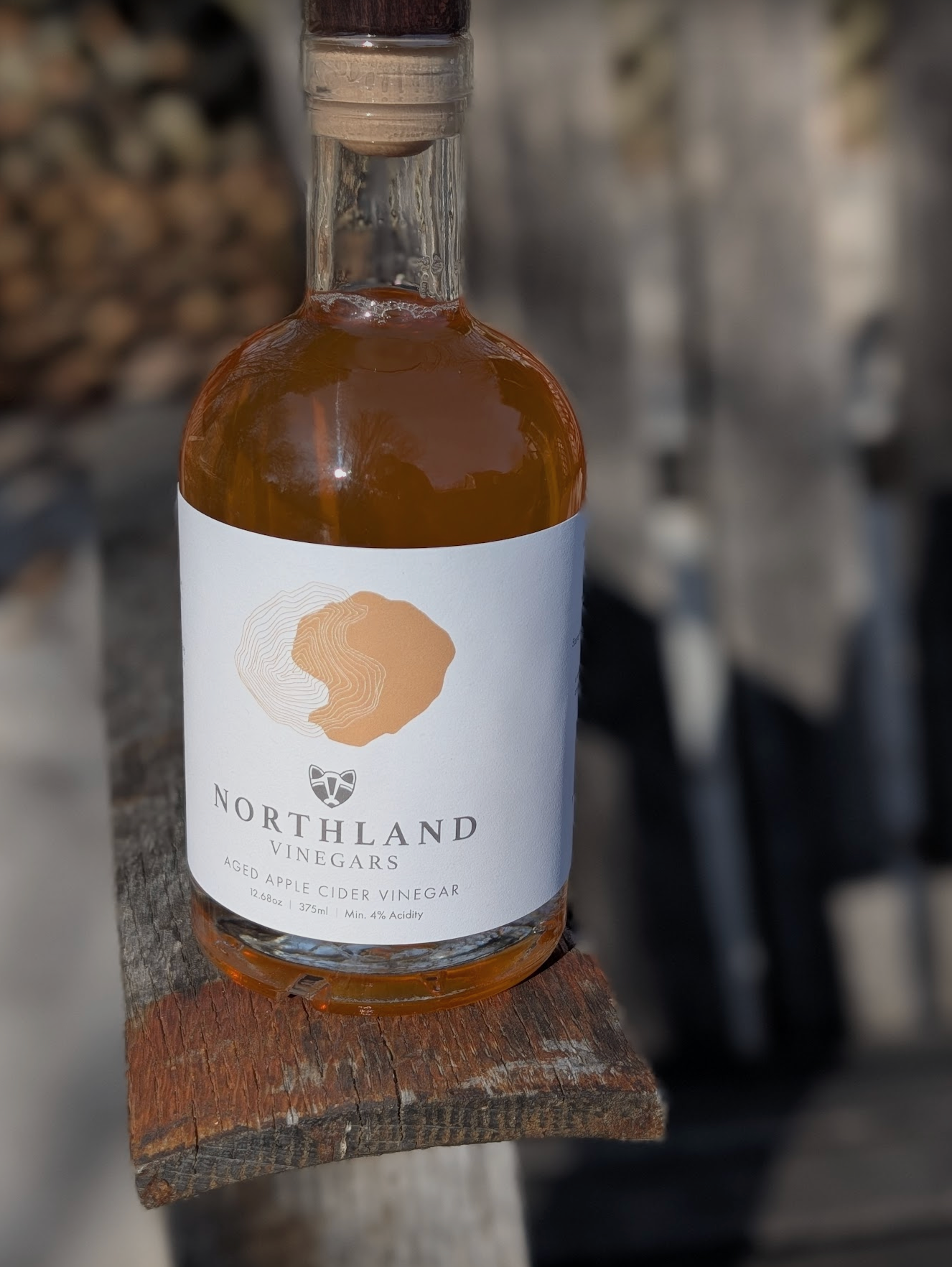 Bottle of Northland Vinegars on a wooden surface with a blurred background