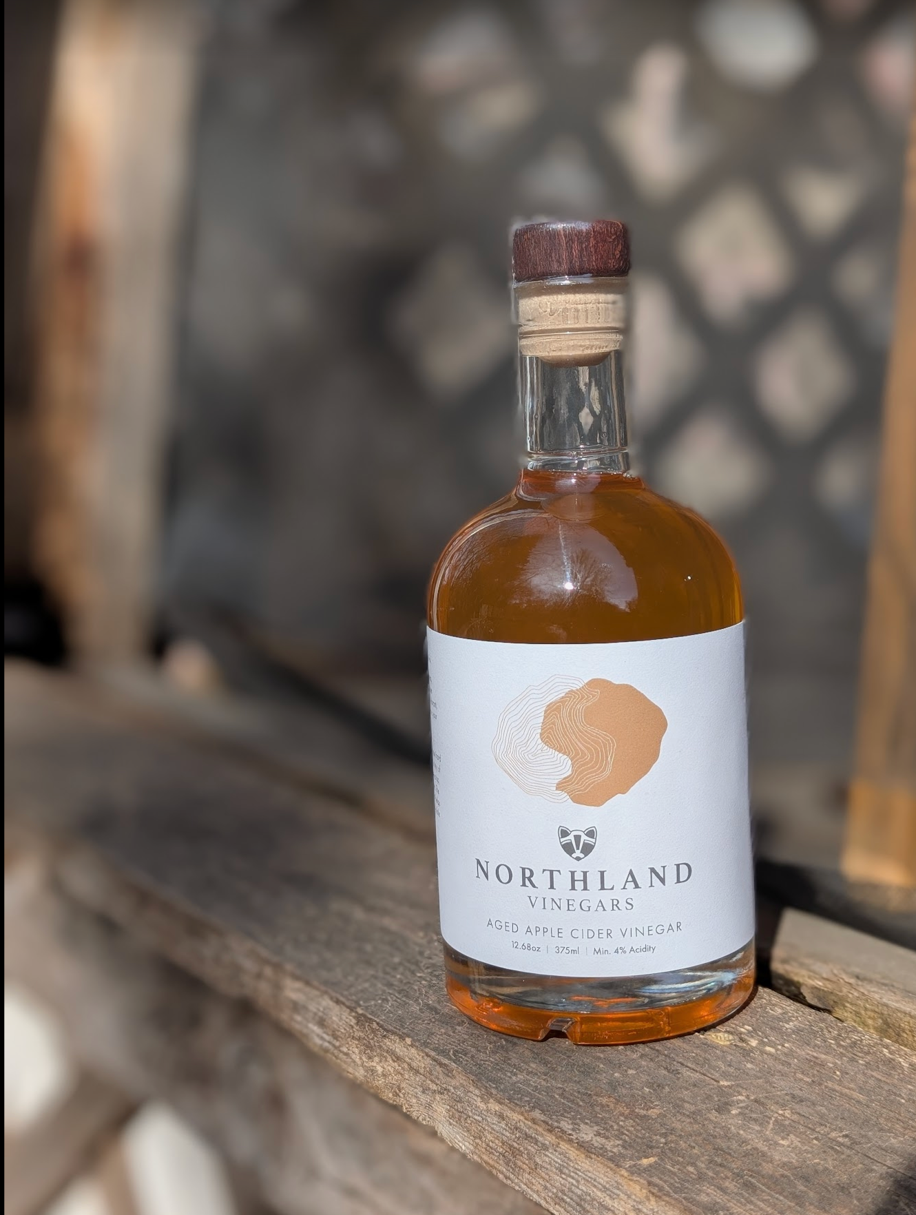 Bottle of Northland Vinegars on a wooden surface with a blurred background