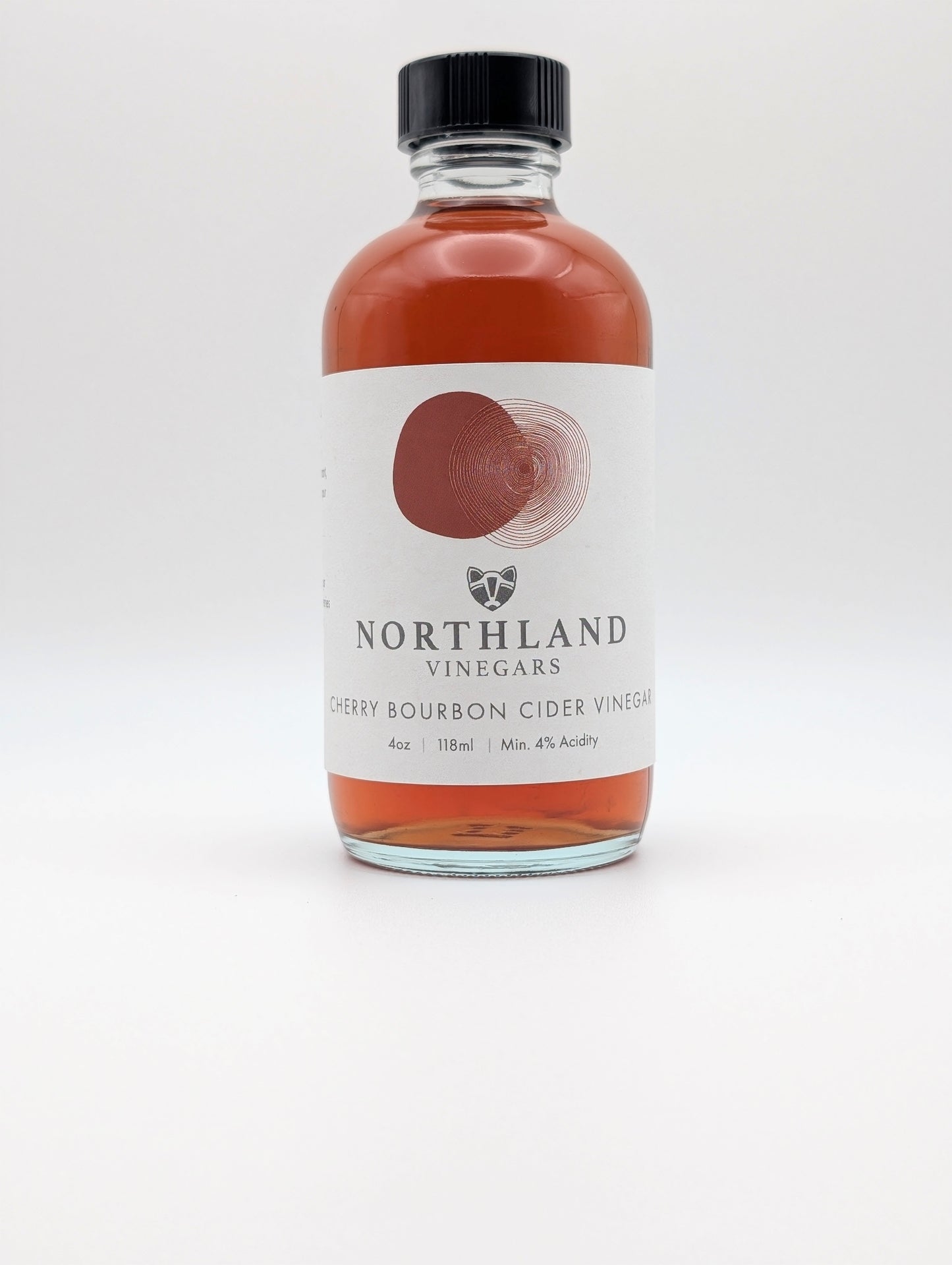Bottle of Northland Vinegars Cherry Bourbon Cider Vinegar on a white background