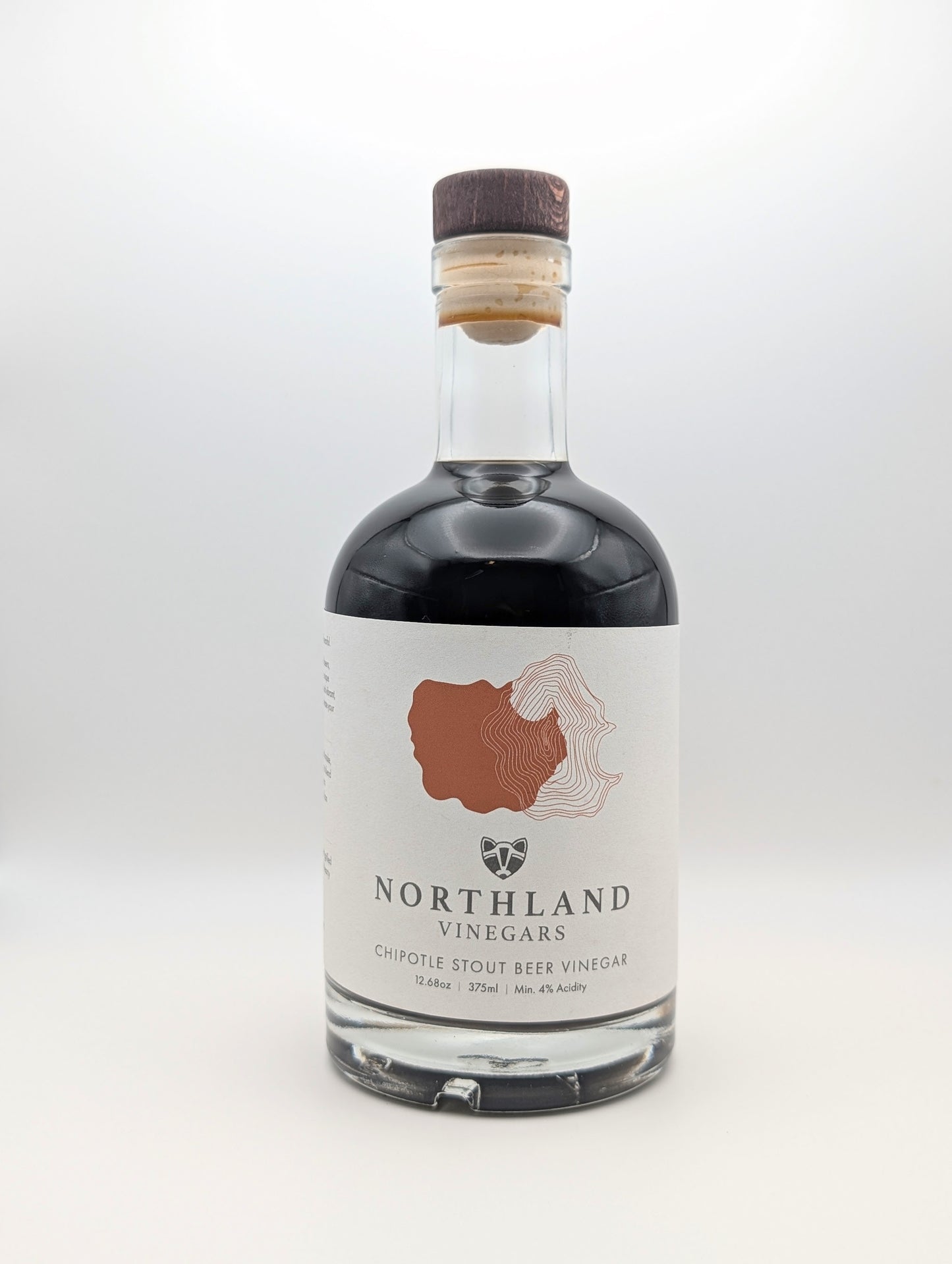 Bottle of Chipotle Stout Beer Malt Vinegar with smoky chipotle and roasted malt notes, crafted in Minnesota.
