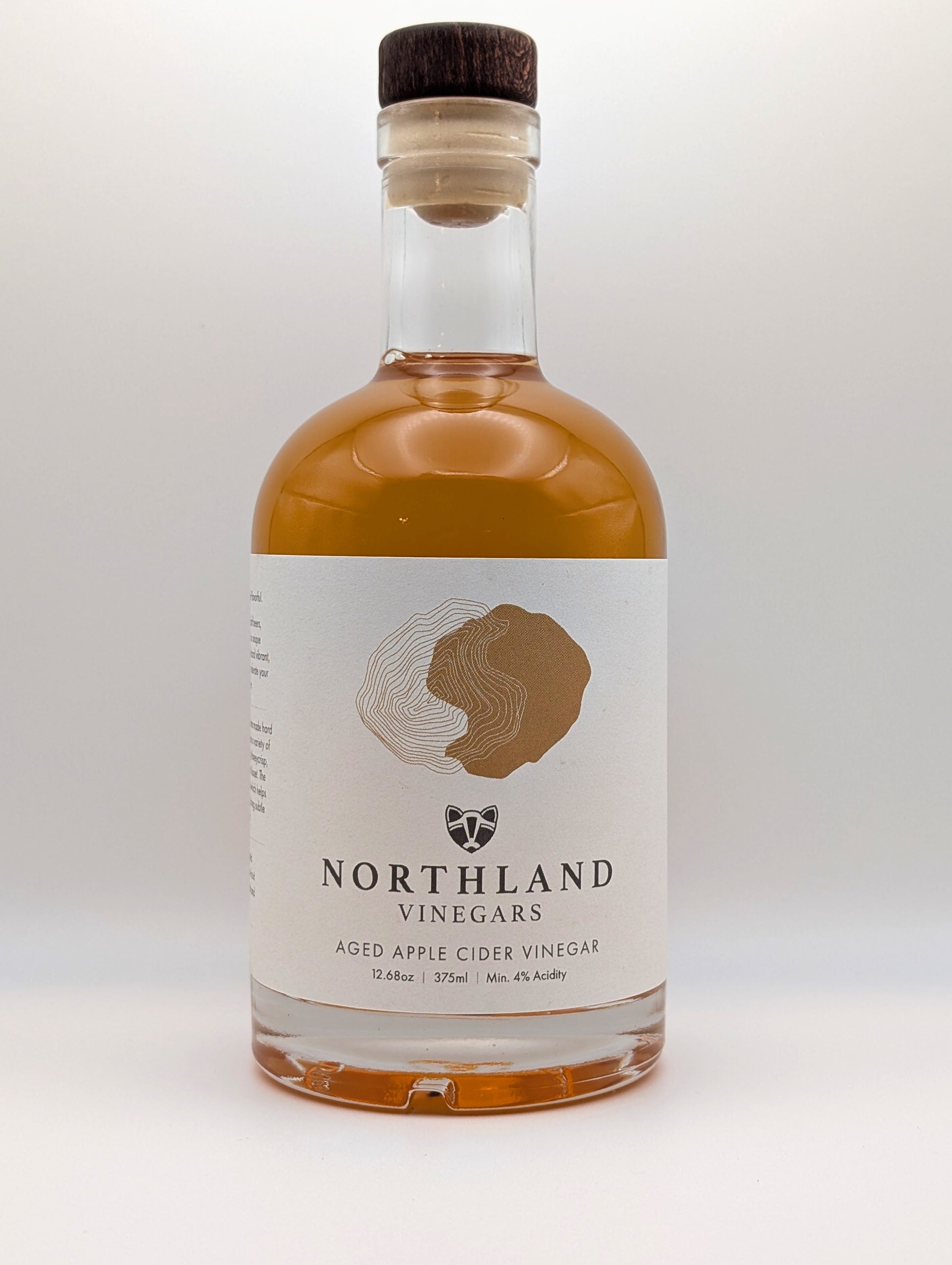 Bottle of Northland Vinegars aged apple cider vinegar on a white background