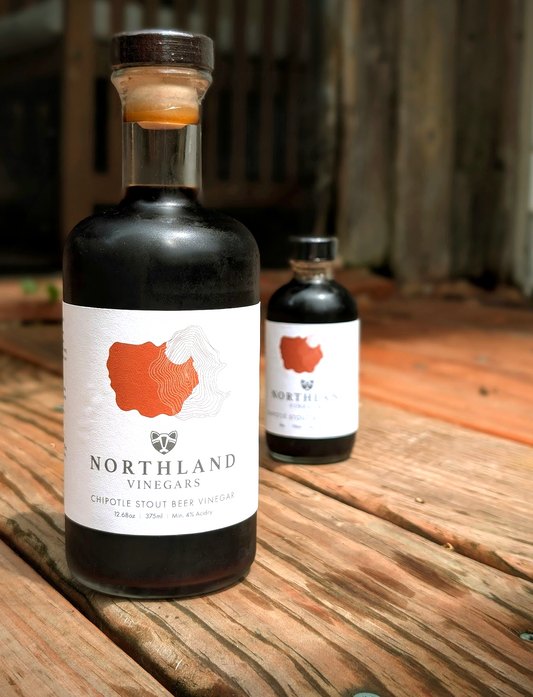 Bottle of Chipotle Stout Beer Malt Vinegar with smoky chipotle and roasted malt notes, crafted in Minnesota.
