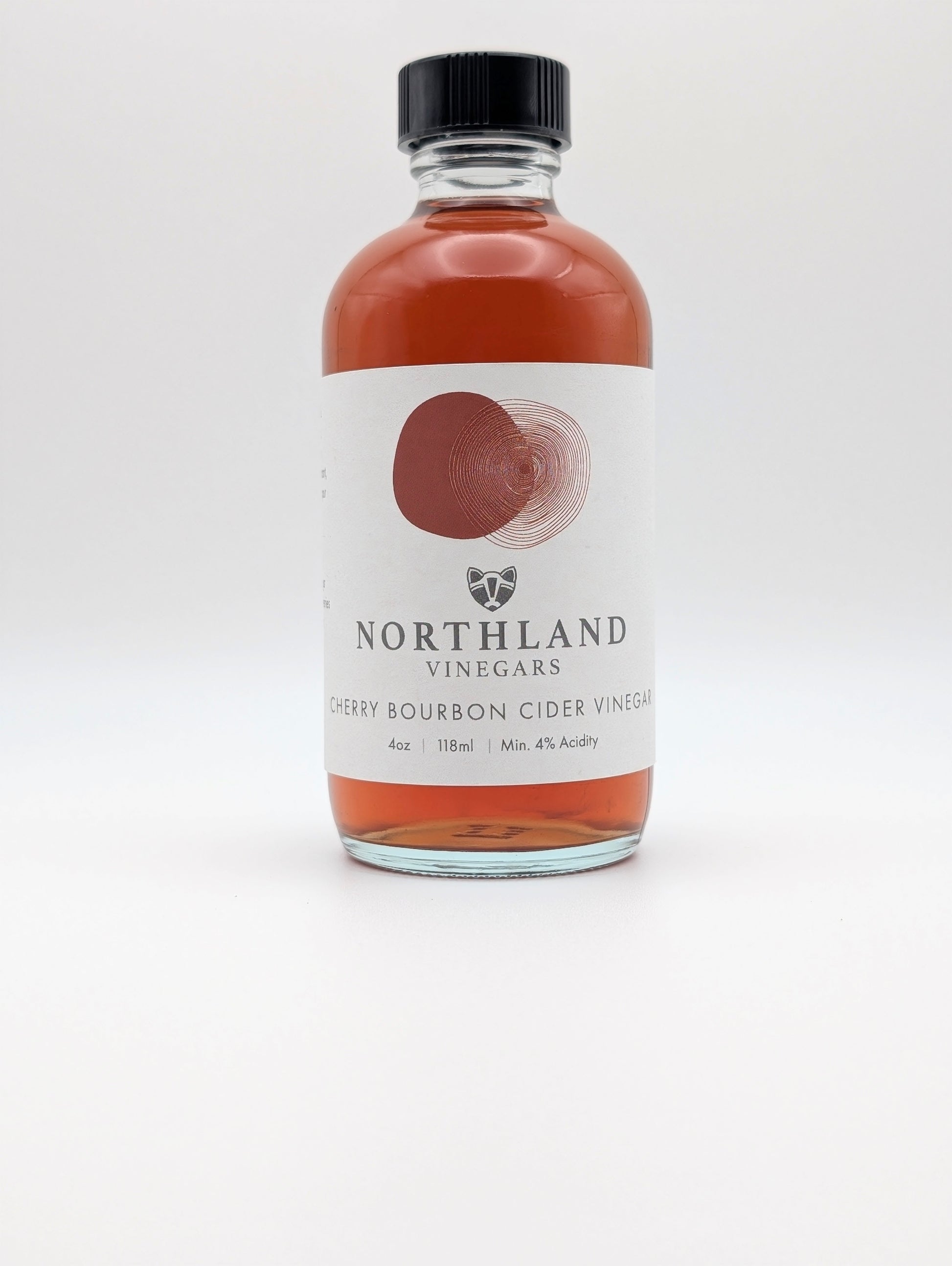 Bottle of Northland Vinegars Cherry Bourbon Cider Vinegar on a white background